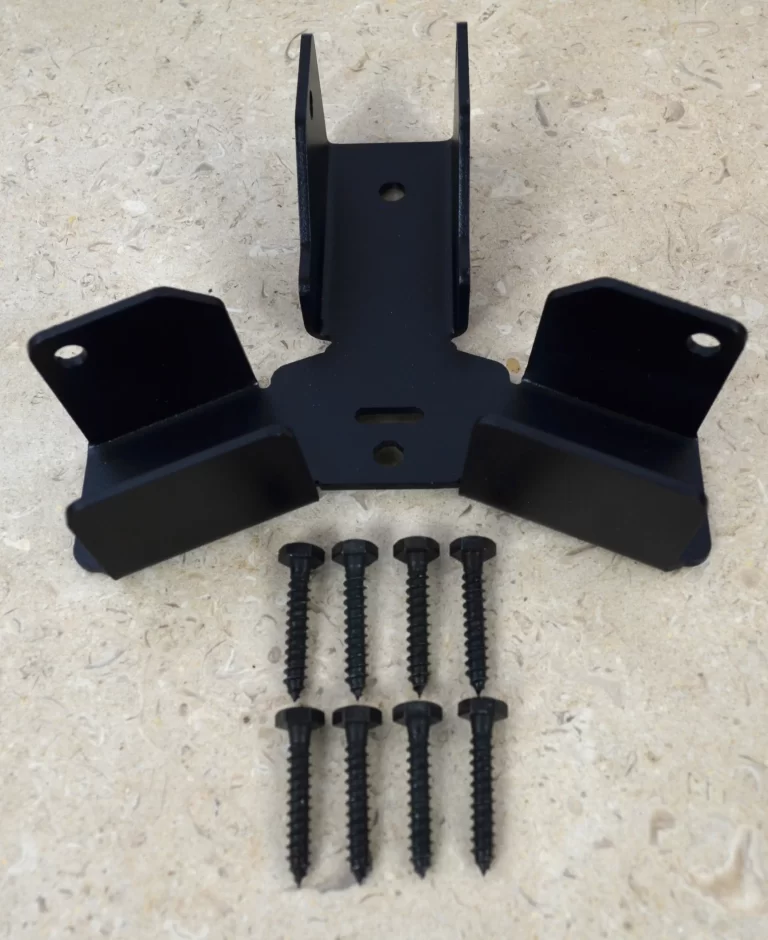 The Heavy Duty Octagon CrossTie Bracket, made of black metal with three mounting sections, is displayed on a beige surface with seven black screws arranged in two rows below it.