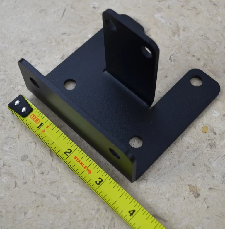 DSC_0144 This black metal open end rafter tie bracket features multiple mounting holes, providing strong support for construction and assembly tasks in various settings.