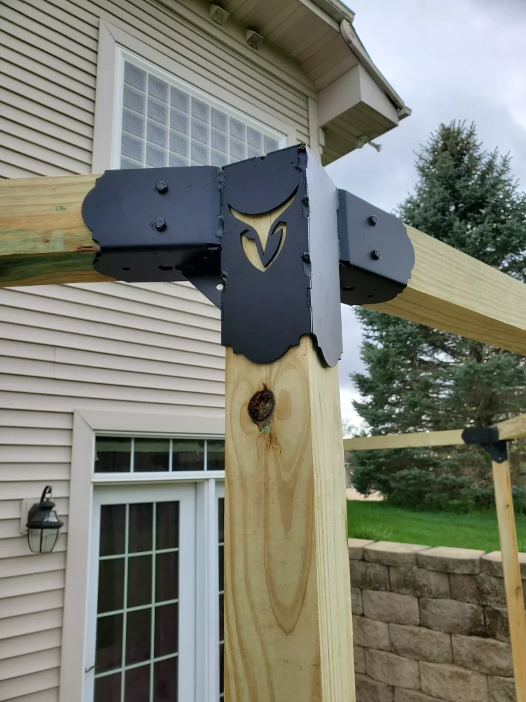 A close-up view highlights a wooden framework corner joint using hexagon elbow bracket, illustrating essential details for a construction project related to home improvement.