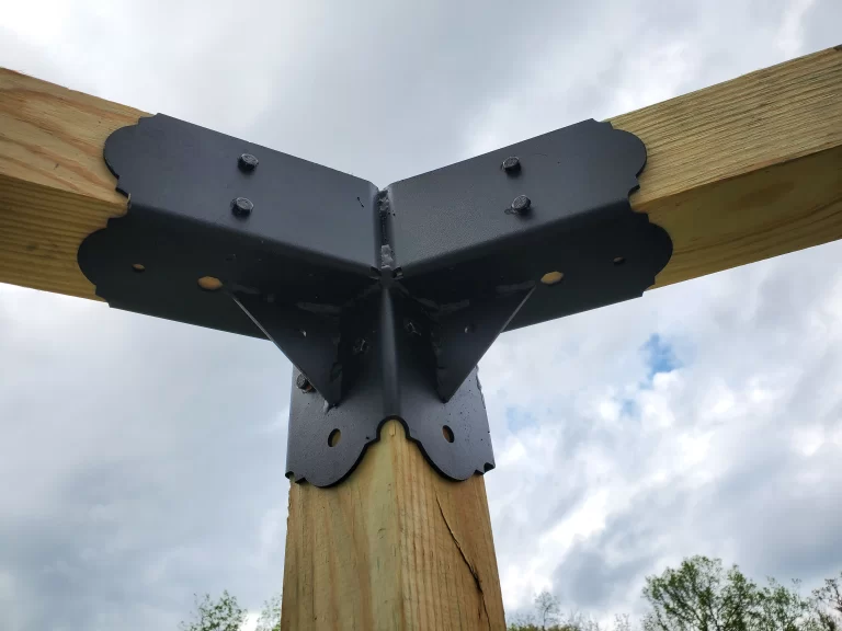 A close-up view highlights a wooden framework corner joint using hexagon elbow bracket, illustrating essential details for a construction project related to home improvement.