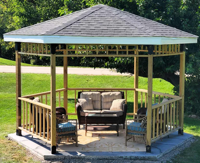 This inviting outdoor lounge area showcases a wooden structure with comfortable seating and a table, perfect for summer entertainment and relaxation.