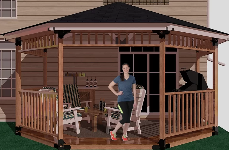 A woman poses elegantly in front of a picturesque partial octagon gazebo, framed by vibrant foliage and a tranquil setting.