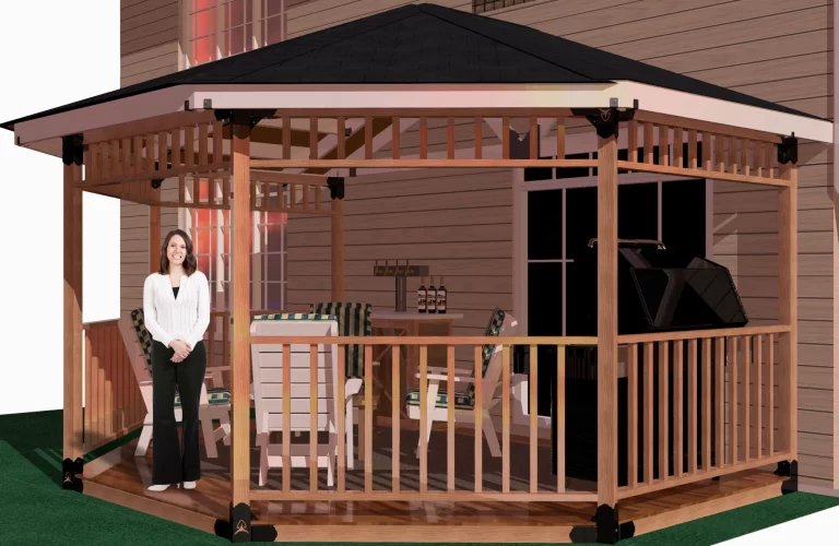 A woman poses elegantly in front of a picturesque partial octagon gazebo, framed by vibrant foliage and a tranquil setting.