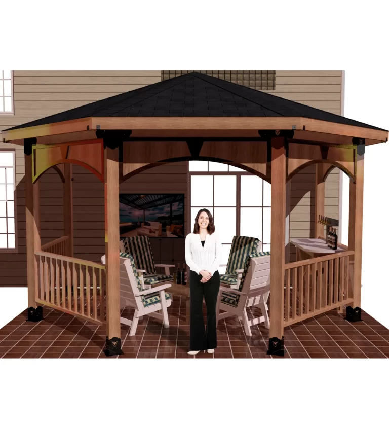 A woman poses elegantly in front of a picturesque partial octagon gazebo, framed by vibrant foliage and a tranquil setting.